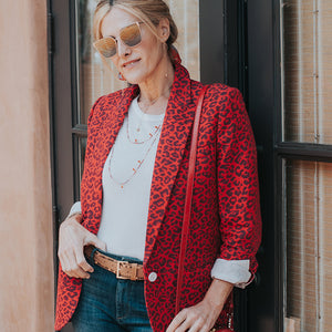 Red animal print blazer and jeans